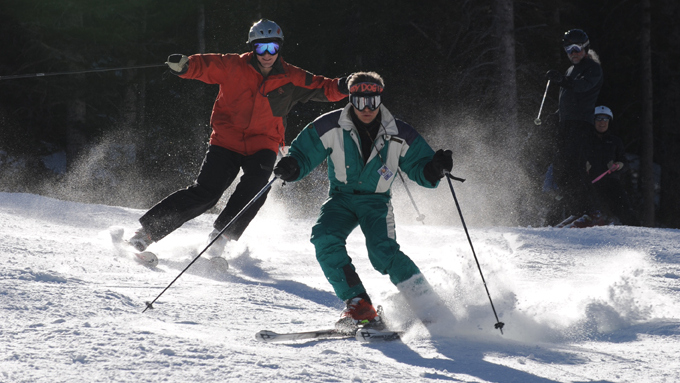 Skiers about to face plant